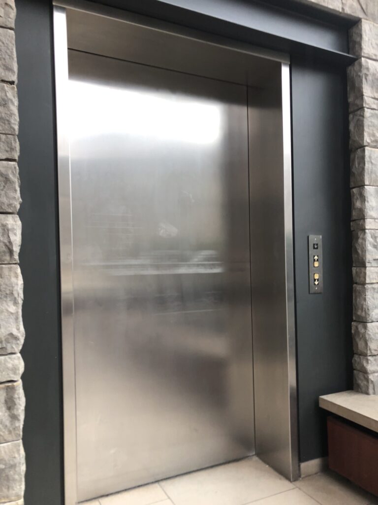 An elevator in the theatre. Both buttons up and down are pressed since the person didn't know where to go and was unaccompanied.