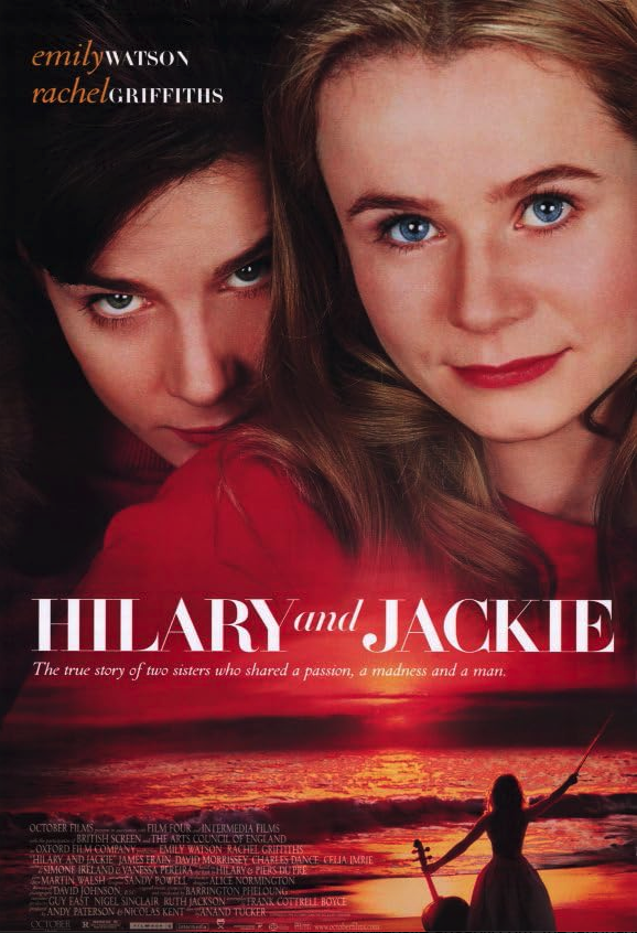 Poster of the movie showing two white women, one with black eyes and one with blue eyes, looking in from of them. At the bottom, a woman on a beach seen from the back holds a cello in a hand and her bow in the other.