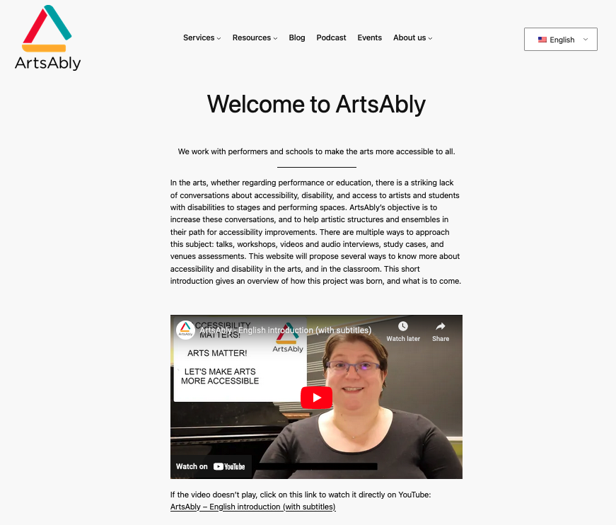 A screenshot of ArtsAbly's website in English, with the logo on the top left, the menu on the top centre, and introduction text and video.