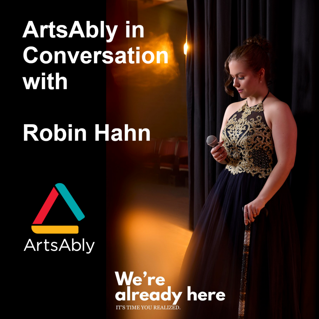 An elegant performer with brown hair in a golden embroidered gown takes a moment backstage. A microphone is in her right hand and she holds a cane with her left hand. A text says: we're already here, it's time you realized.